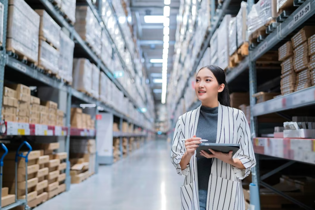 portrait-asian-woman-business-owner-using-digital-tablet-checking-amount-stock-product-inventory-shelf-distribution-warehouse-factorylogistic-business-shipping-delivery-service